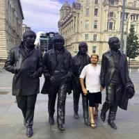Teaser image of a student standing between statues of the The Beatles in the United Kingdom - Click to learn more about these resources