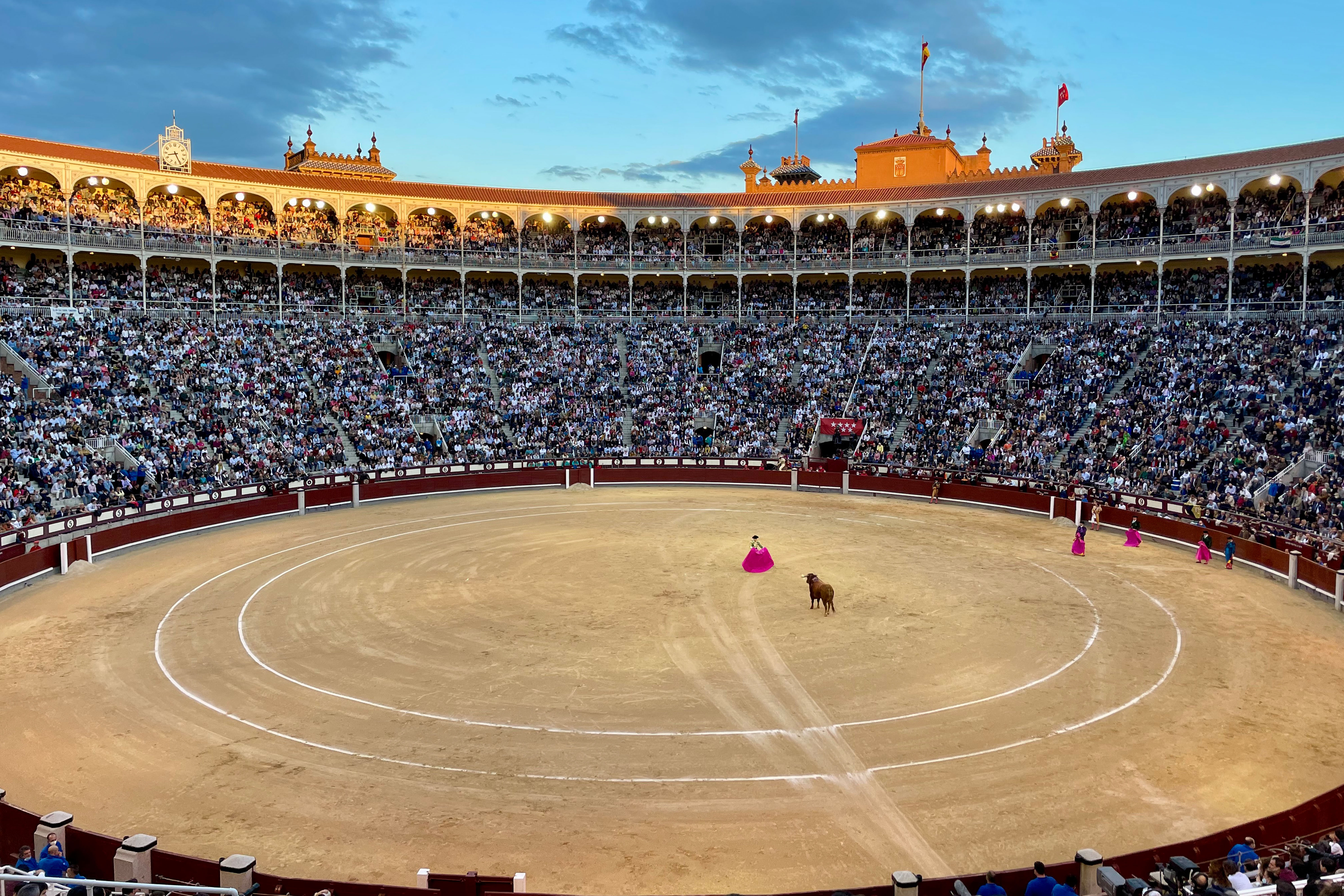 Photo of a large stadium where people are gathered to watch a Spanish bullfight