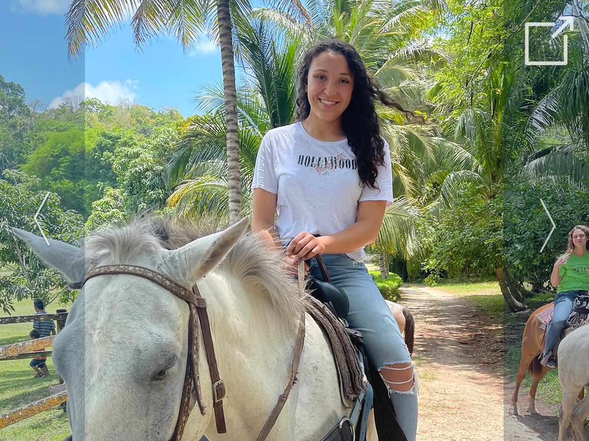 photo of a student sitting on a horse during her internship abroad