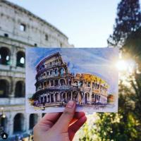 Teaser image of a student holding up a photo of an iconic structure in Italy - Click to learn more about these resources