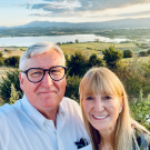 Lange and Puma smile overlooking the Umbria region in Italy.