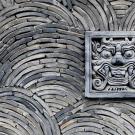 photo of a wall with a spiral design and a section of the wall with an artistic frame