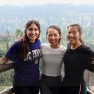 Image of three students looking into the camera and smiling